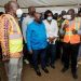 President Akufo-Addo (middle) being shown the drawings of the road