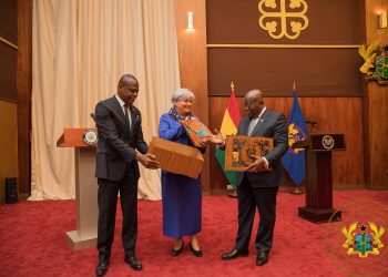 Stephanie S. Sullivan, outgoing US Ambassador to Ghana  (middle) receiving the award from President Akufo-Addo (right)