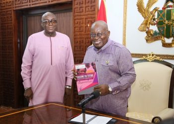 President Akufo-Addo (Right) receiving the report from Harry B. Sintim,  Board Chair, Head of State Award Scheme-Ghana