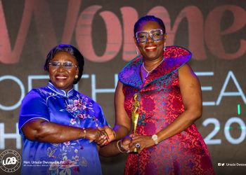 Mrs Ursusla Owusu-Ekuful (Right) receiving the award